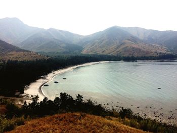 Scenic view of lake and mountains against sky