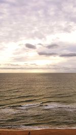Scenic view of sea against cloudy sky