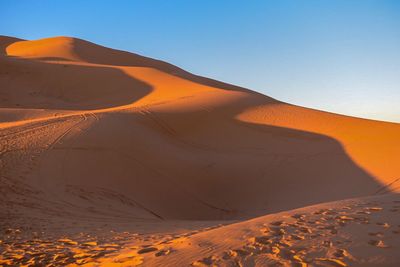 Scenic view of desert against clear sky