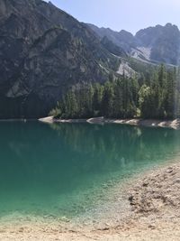 Scenic view of lake and mountains against sky