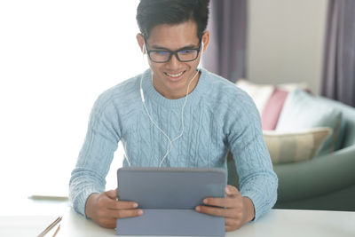 Young man using mobile phone