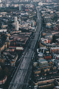 Aerial view of elevated road amidst buildings in city