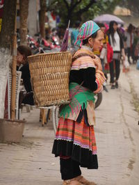 Woman standing in basket