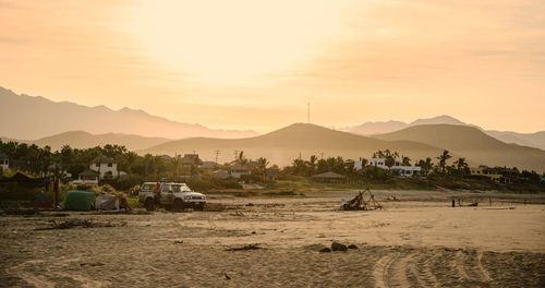 Beach at el pescadero against sky during sunrise