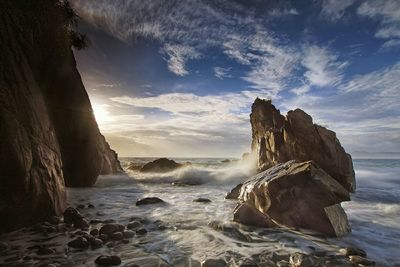 Scenic view of sea against cloudy sky