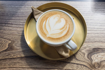 Close-up of cappuccino on table