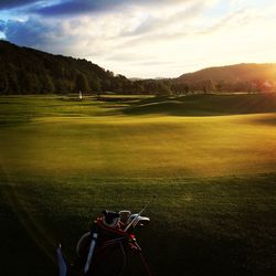 High angle view of golf course on field against sky