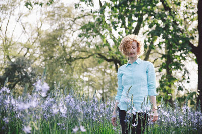 Young woman standing in lavender field