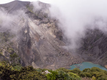 Smoke emitting from volcanic mountain