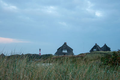 House on field against sky