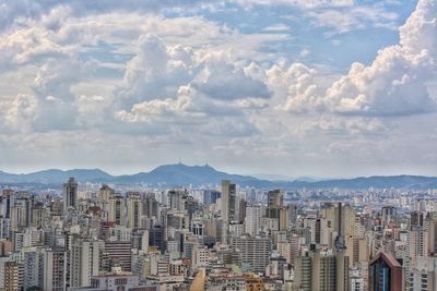 Aerial view of cityscape against sky