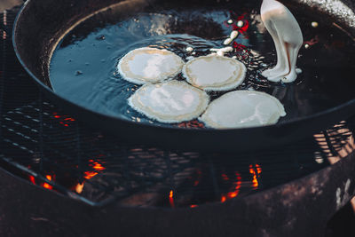 High angle view of candles on barbecue grill