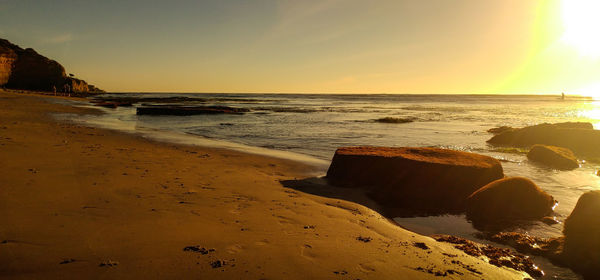 Scenic view of beach during sunset