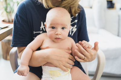 Portrait of cute baby boy in a summer day at home