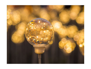 Close-up of illuminated light bulb