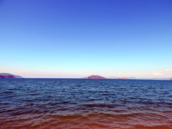 Scenic view of sea against clear sky during sunset