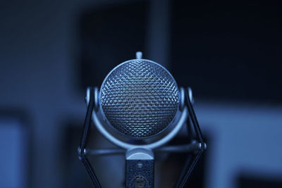 Close-up of microphone against blurred background