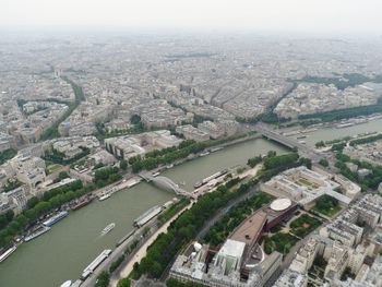 High angle view of river amidst buildings in city