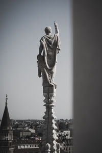 Low angle view of statue against sky