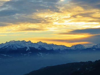 Scenic view of mountains against sky during sunset