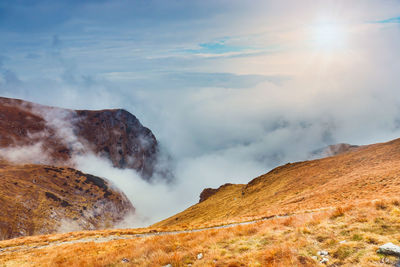Scenic view of volcanic mountain against sky