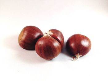 Close-up of fruits over white background