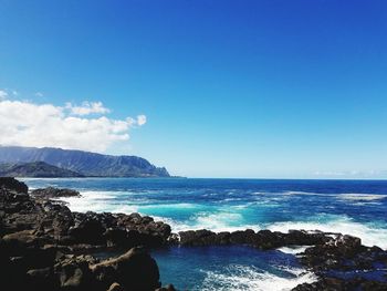 Scenic view of sea against clear blue sky