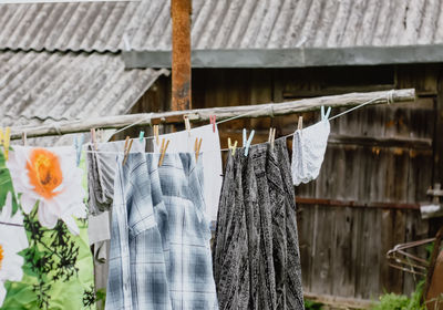 Close-up of clothes drying on railing