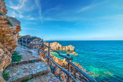 Scenic view of sea against blue sky