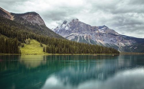 Scenic view of lake and mountains against sky