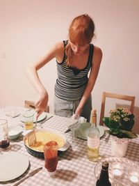 Woman having food at table