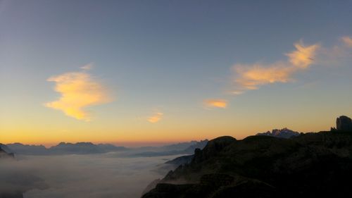 Scenic view of mountains against sky during sunset