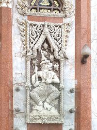 Close-up of statue against temple
