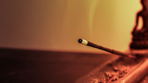 Close-up of incense burning at home