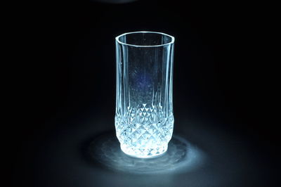 Close-up of drinking glass against black background