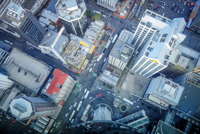 High angle view of traffic on city street amidst buildings