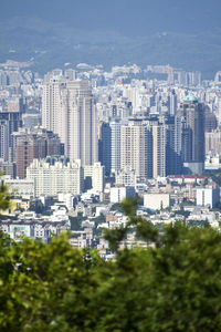 High angle view of buildings in city against sky