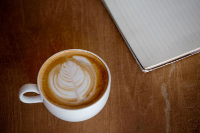 High angle view of cappuccino on table