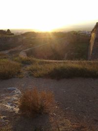 Scenic view of landscape against sky during sunset