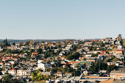 Aerial view of townscape against clear sky