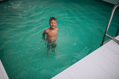 High angle view of boy in swimming pool