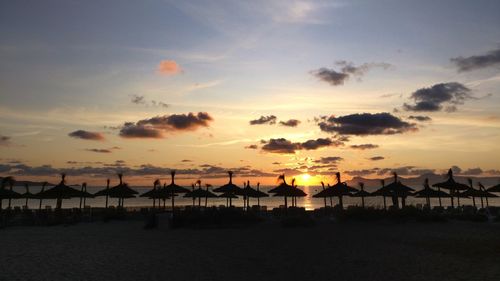 Scenic view of beach against sky during sunset