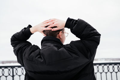 Rear view of young woman looking at view