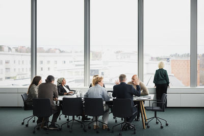 Business people having meeting in boardroom