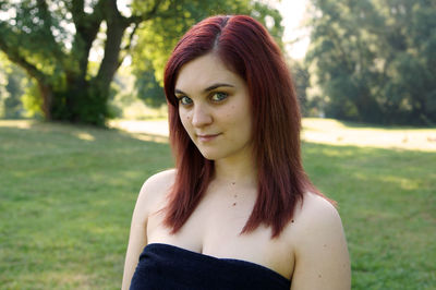 Portrait of beautiful woman on field