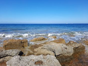 Scenic view of sea against clear sky