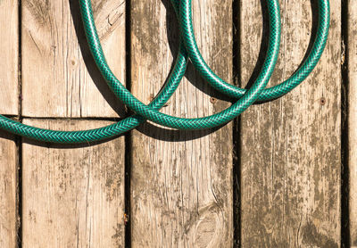 Close-up of rope tied on wood