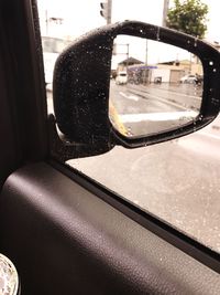 Reflection of car on side-view mirror