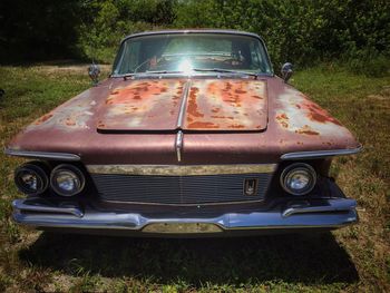 Vintage car on grassy field