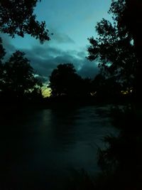 Scenic view of lake against sky at sunset